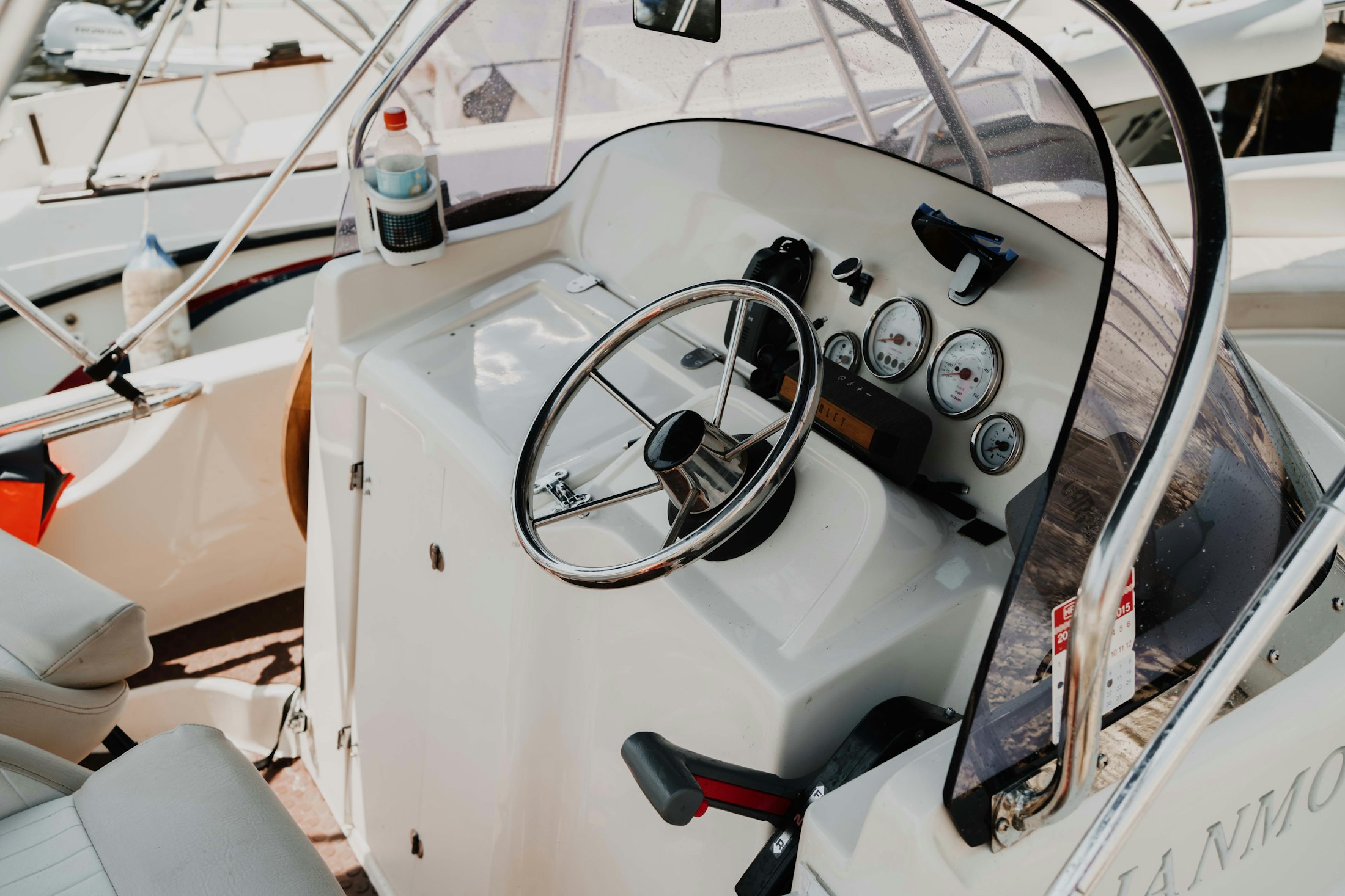 Boat helm with steering wheel and navigation instruments