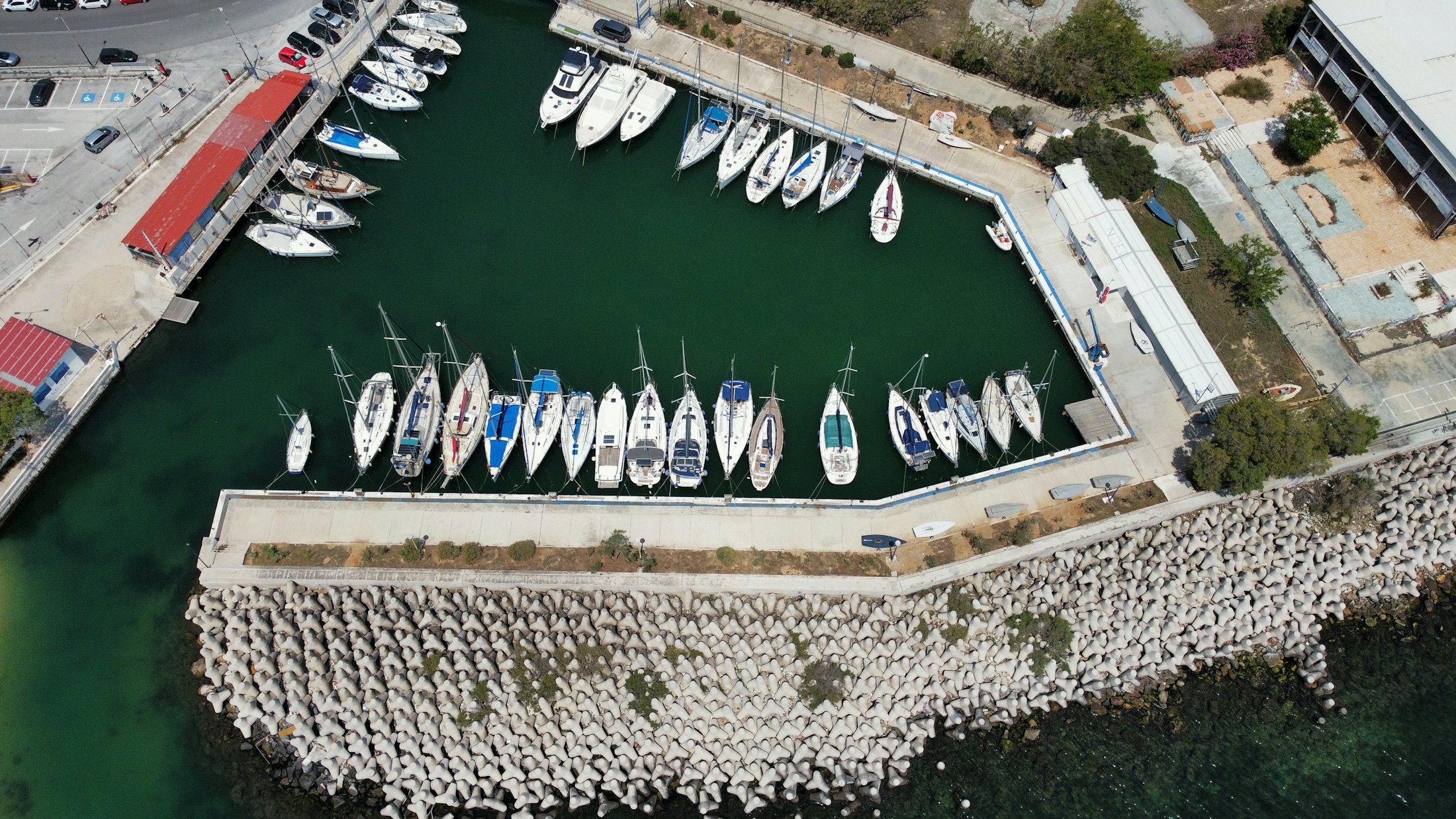 Aerial view of a marina with moored yachts and boats